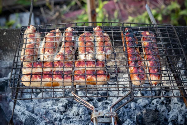 Grilled sausages at the stake. Food theme. — Stock Photo, Image