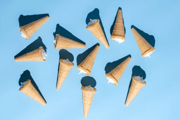 Ice cream cones on blue table. Summer background. — Stock Photo, Image