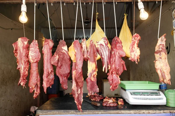 Pieces of fresh meat are on sale in the market