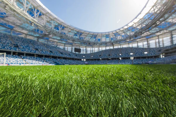 Sport grass field stadium on a sunny day blue sky. — Stock Photo, Image
