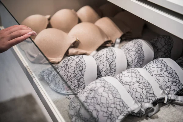 Feminine lacy underwear stored in cases in a wardrobe — Stock Photo, Image