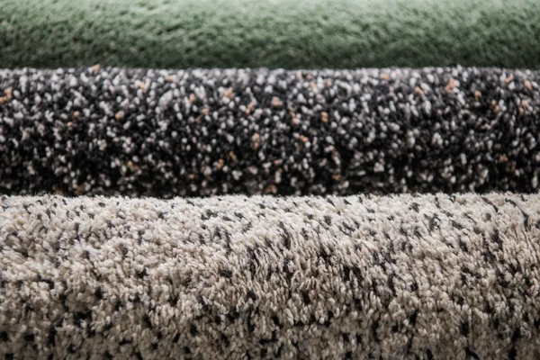 Set of three different colorful artificial shaggy carpets. — Stock Photo, Image
