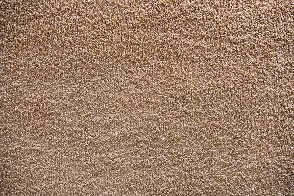 Artificiale tappeto beige texture close-up sfondo — Foto Stock