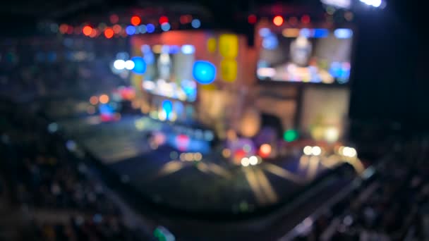 Esports event blurred backgroung. Main stage, lightning, illumination, big screen with game moments from overlooking spot at the top. — Stock Video