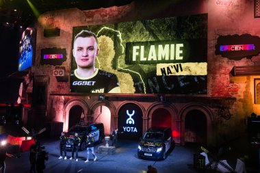 MOSCOW, RUSSIA - OCTOBER 27 2018: EPICENTER Counter Strike: Global Offensive esports event. Player Egor flamie Vasilyev on a main screen. Introduction of a team NaVi Natus Vincere before the match. clipart
