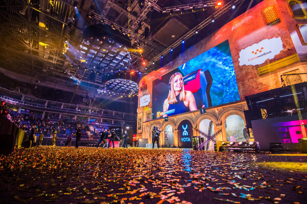 MOSCOW, RUSSIA - OCTOBER 27 2018: EPICENTER Counter Strike: Global Offensive esports event. Tournament is finished. Beautiful girl commentator on a big screen. Floor covered with a sparkles confetti
