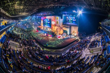 MOSCOW, RUSSIA - OCTOBER 27 2018: EPICENTER Counter Strike: Global Offensive esports event. Colorful main stage venue with lot of illumination and tribunes full of visitors and fans. Overlooking clipart