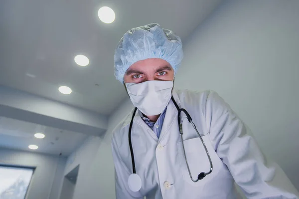 Surgeons looking down at patient getting ready for urgent surgery