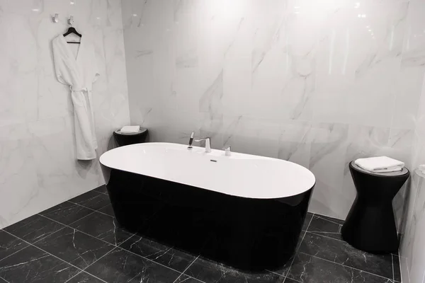 Modern minimalism style bathroom interior in black and white tones