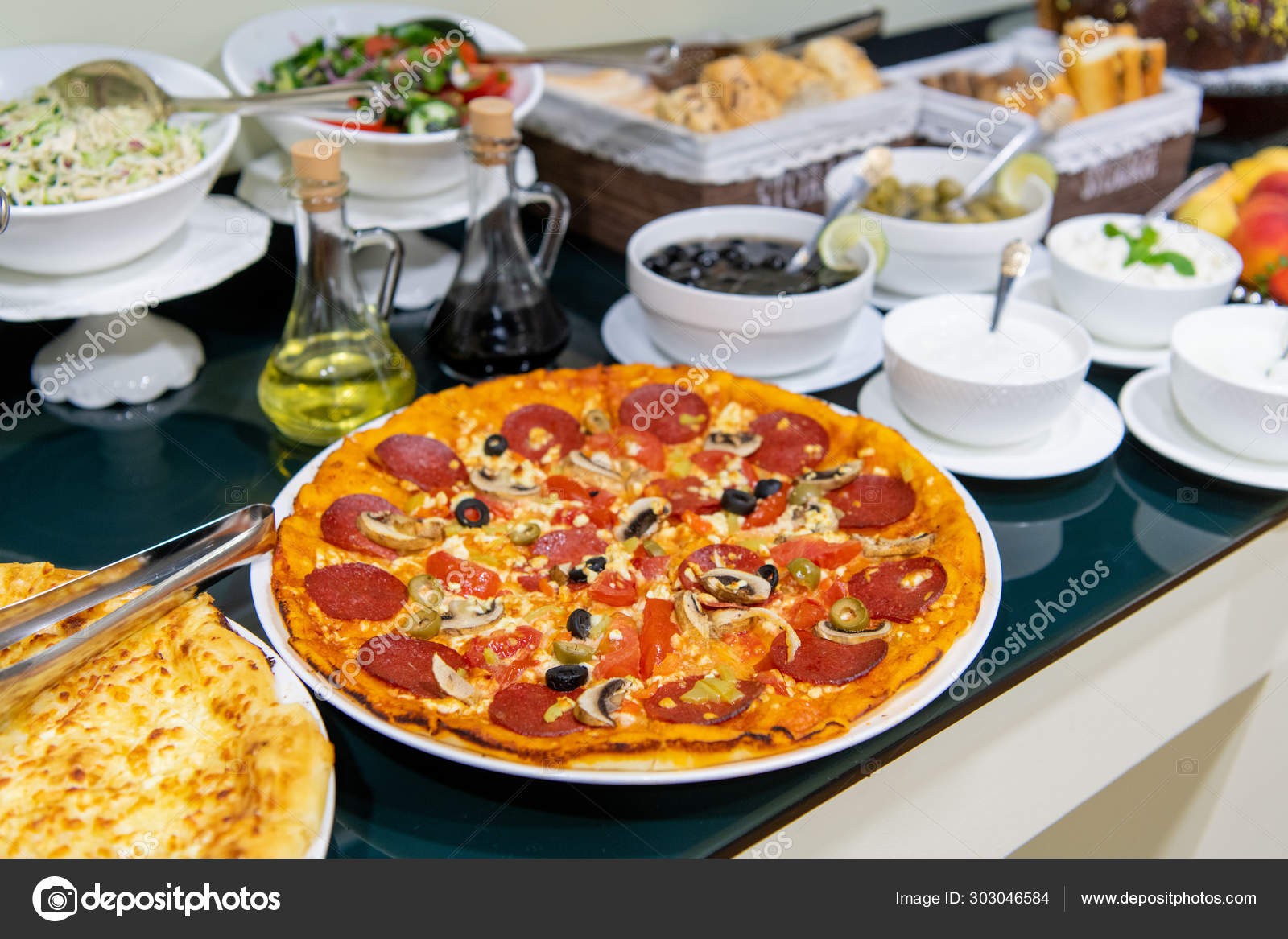 Food and Buffet Decoration with pizza and lots of dishes in a hotel Stock  Photo by ©romankosolapov 303046584