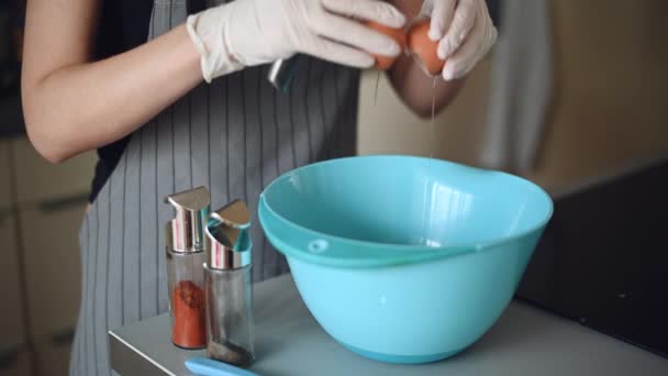 Close up chef hand braking an egg into a blue bowl then mix to prepare omelet cooking , 4k ProRes resolution — Stock Video