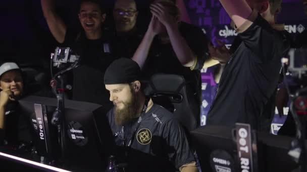 MOSCOW - 14th SEPTEMBER 2019: esports Counter-Strike: Global Offensive event. Players booth with team Ninjas in Pyjamas legend player Patrik f0rest Lindberg inside on a stage having fun. — Stock Video