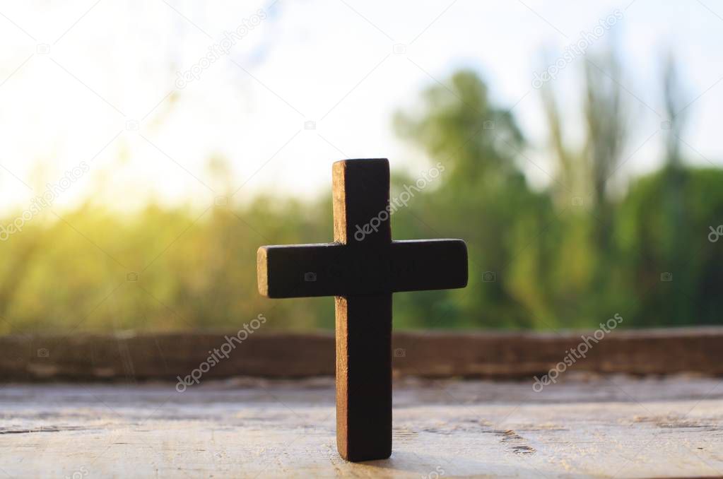 cross on a wood background . Cross against the sky . 