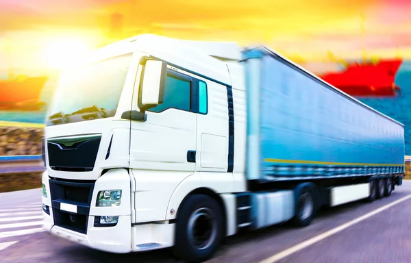 the truck goes port .  Commercial transport .  truck transport container . port of delivery of goods . Commercial transport .  truck transport container   . transportation of freight Europe . industrial infrastructure .