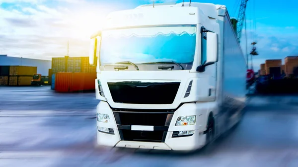 the truck goes port .  Commercial transport .  truck transport container . port of delivery of goods . Commercial transport .  truck transport container   . transportation of freight Europe . industrial infrastructure .