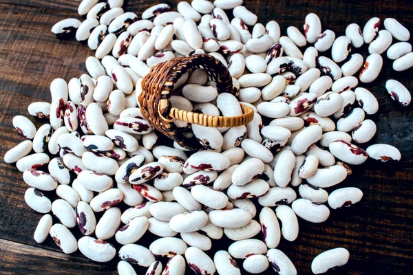 White beans . Colorful variety mixed beans . on a wooden table.