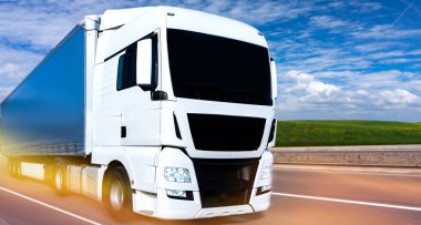 the white truck rushes on the highway. delivery of goods across Europe
