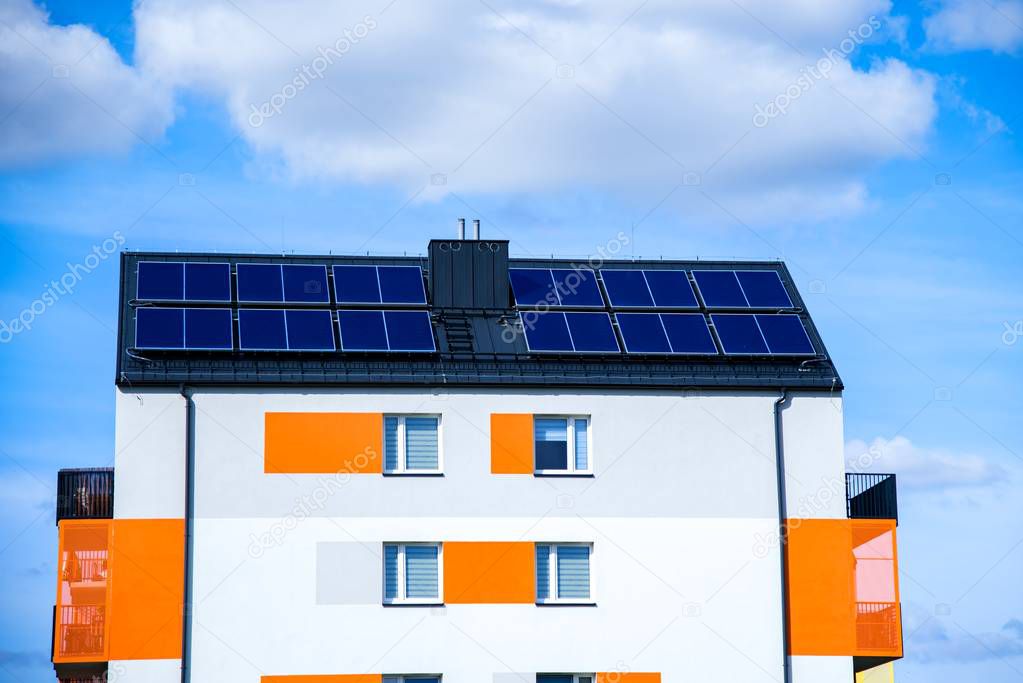 Solar panels on the roof of a building . Solar cells for solar energy . apartment house