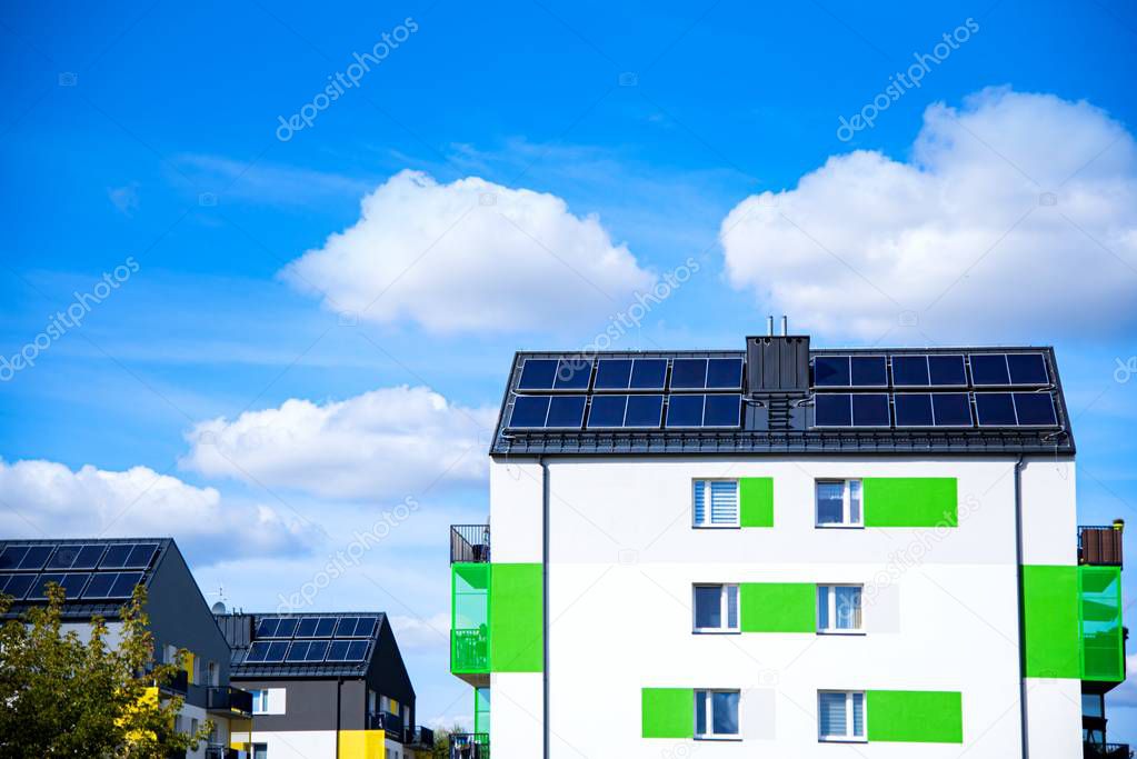 Solar panels on the roof of a building . Solar cells for solar energy . apartment house