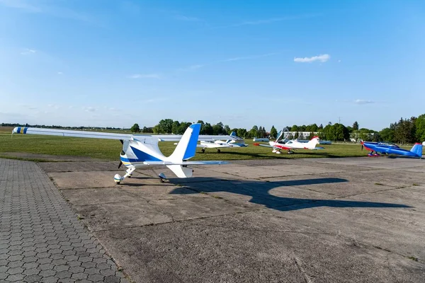 Small aircraft with propeller in parking lot . flight field and many aircraft in Poland 10 /06/2020