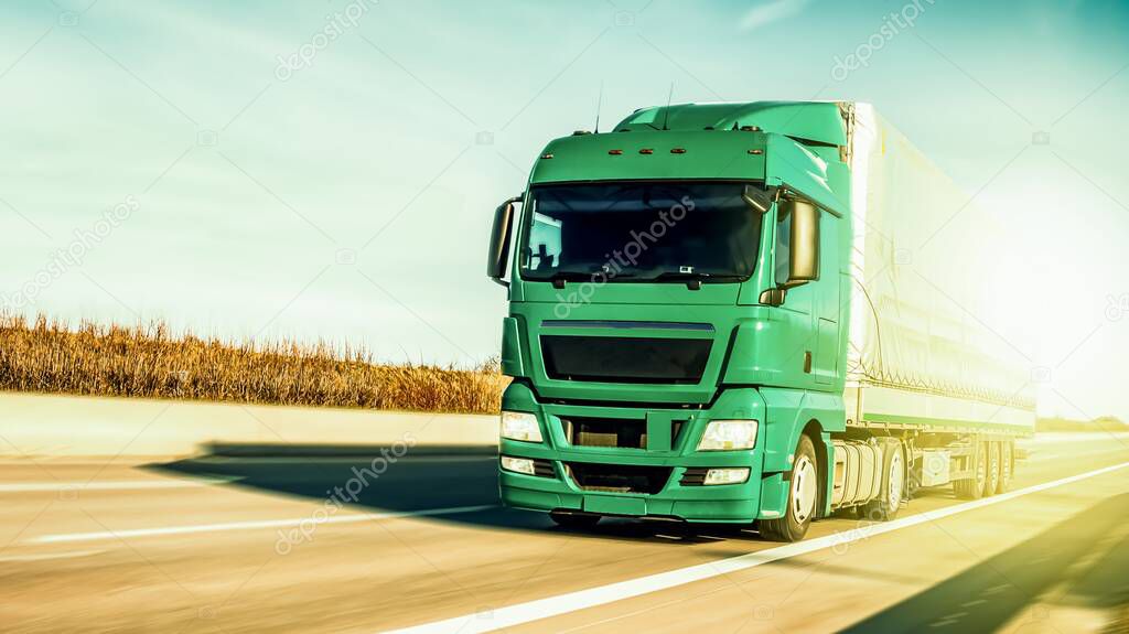 Green truck on the roads of Europe . Logistics and transportation