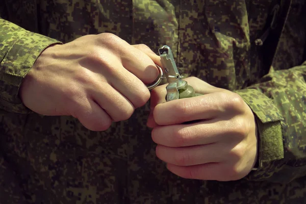 Grenade, Hands on Pin. the soldier pulls a check from a fragmentation grenade RGD-5. Self-explosion.