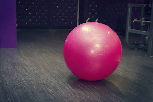 Exercise pink color ball in fitness, gym equipment and fitness balls in sports club. Sports indoors Exercise Balls,Massage Ball, Exercise Therapy Rubber.