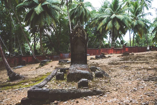 old iron forged old crosses in the cemetery. An grave in an abandoned cemetery of the 19th century in the Andaman Islands. shabby Christian Agila in the jungle. Asia. Ross island India