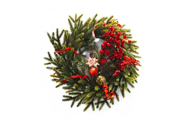 christmas wreath new year isolated on white background. beautiful spruce wreath with red flowers, balls, berries and stars.