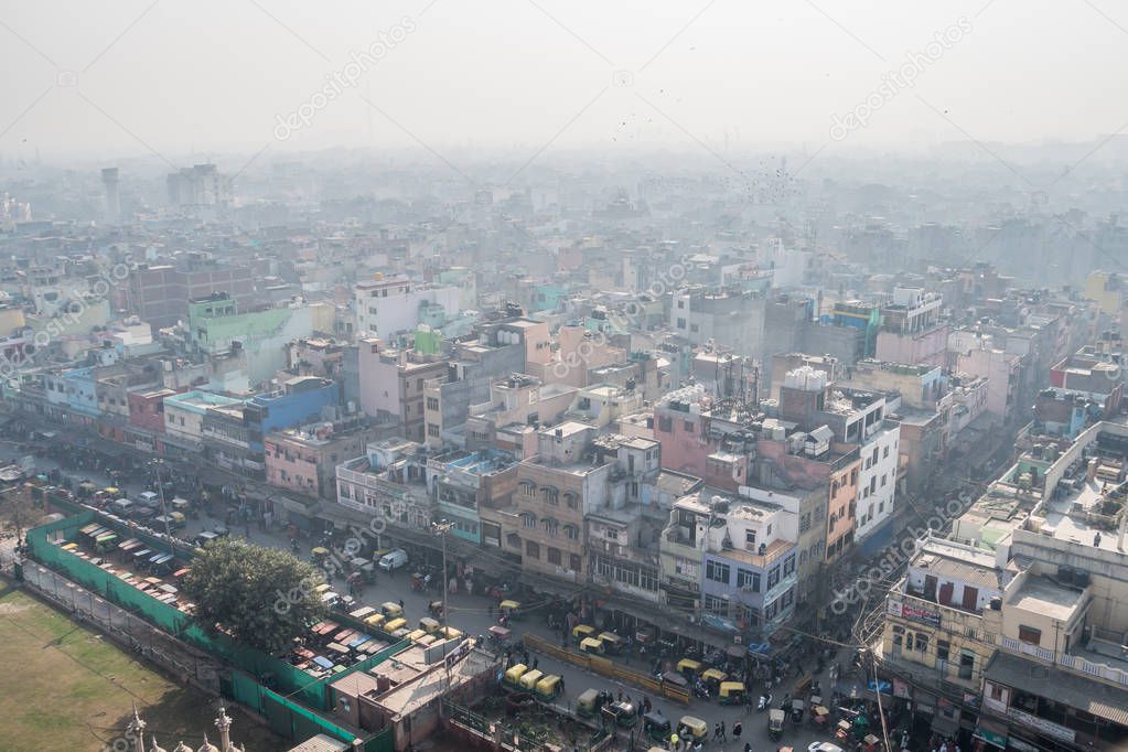 The streets of old Delhi. The view from the top. Dense construction of urban agglomeration in the overpopulated city. NEW DELHI, UTTAR PRADESH, INDIA - 07.01.2018