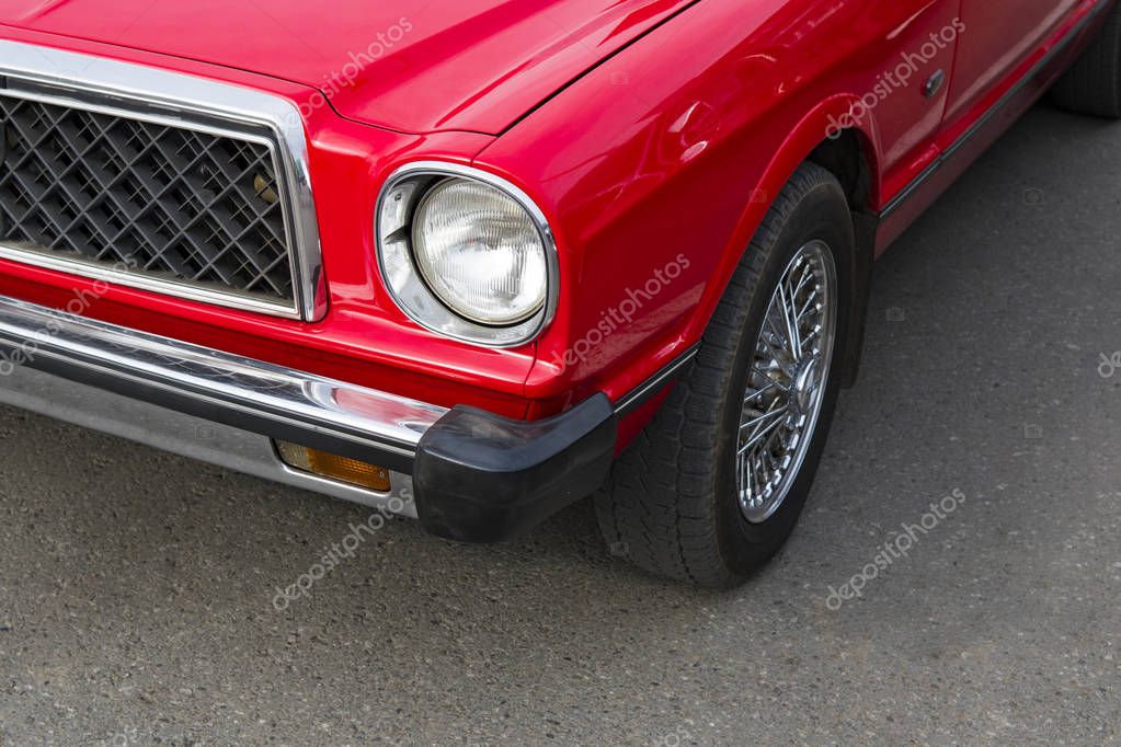 A parked vintage renewed polished car. Retro car lovers. Restoration of classical soviet cars. Retro car rental. New life of a retro car.