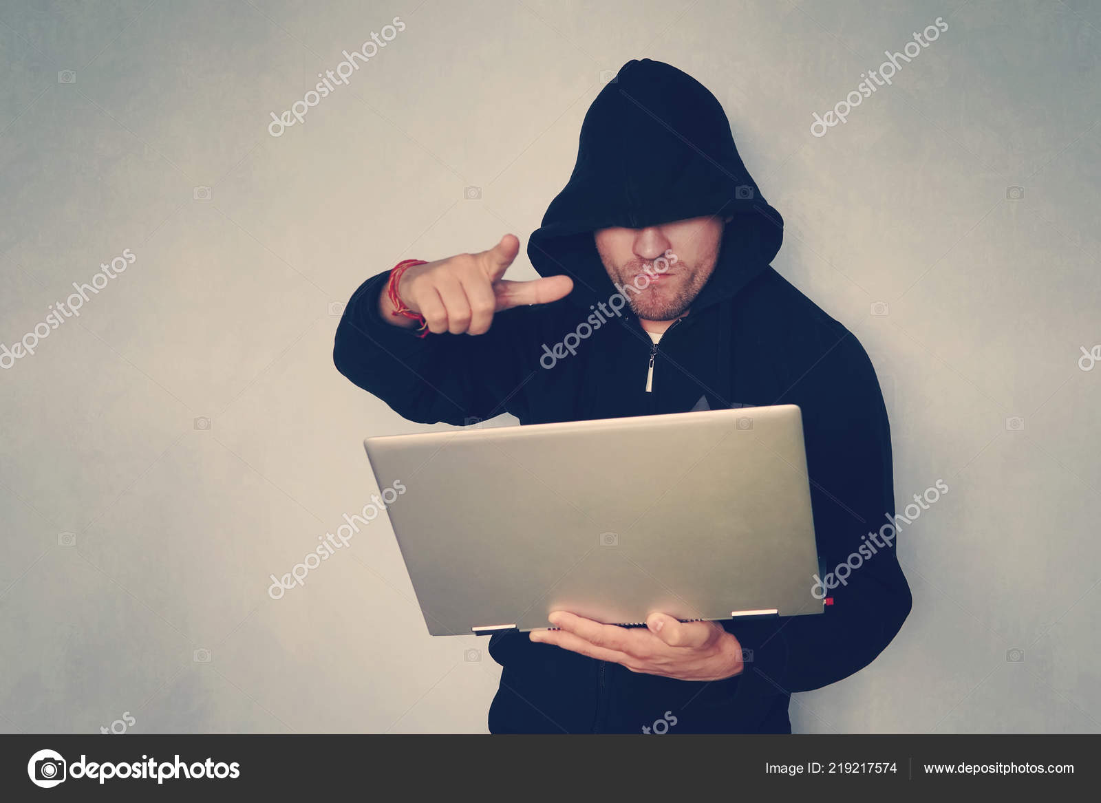 Hacker Holding Gun Working His Computer Terrorist Bandit Concept Glitch