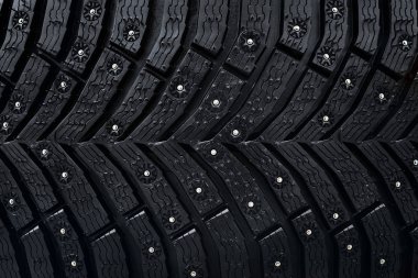 Tekerlek lastiği seamless modeli. A yakın çekim bir lastik koruyucu ve Çıtçıt. Kış lastik doku. Gerçekçi illüstrasyon. Siyah kauçuk, Çıtçıt ve koruyucu arka plan.