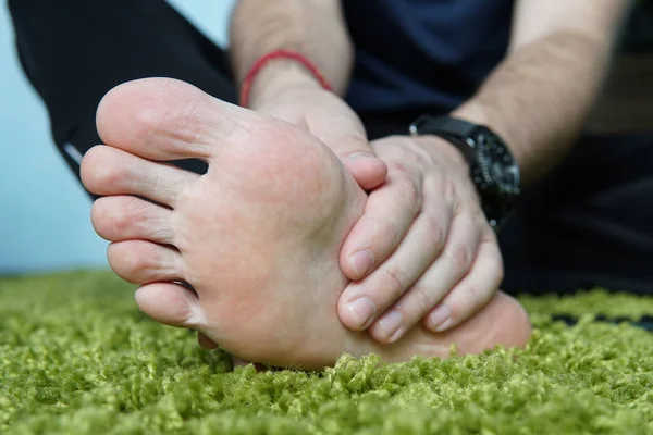 Pain in the foot. Massage of male feet. Pedicures. broken foot, a sore foot, massaging the heel