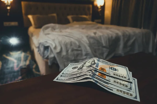 room tip. bed and money to symbolize the cost of sex. Paid love the prostitute. Payment for the services of prostitutes. A tip for the staff.