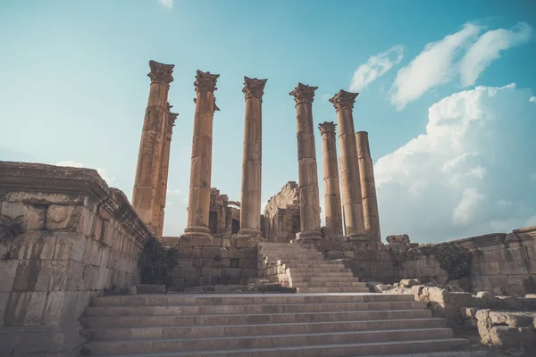 Roman architecture. old historic district of Jarash. High beautiful antique columns against the blue sky. Temple of Artemis in the ancient Roman city of Gerasa in Jarash, Jordan.