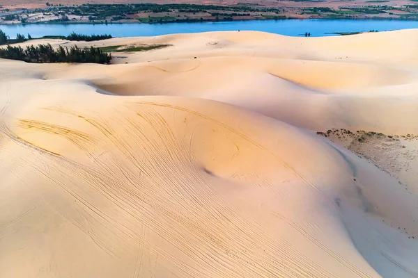 sand dune in Mui Ne, Vietnam. Beautiful sandy desert landscape. Sand dunes on the background of the river. Dawn in the sand dunes of MUI ne