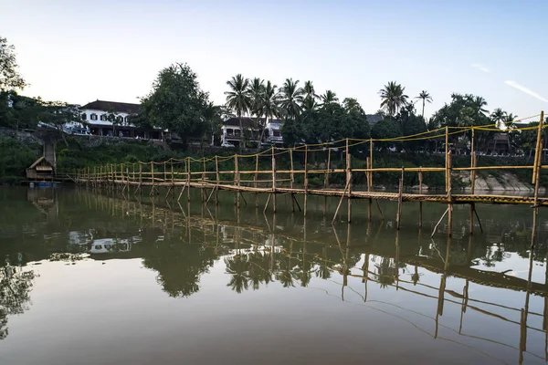 Bamboo bridge build annually at low water in dry season over Nam Khan River at confluence of Mekong River in Luang Prabang