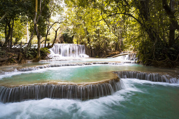 The Kuang Si Falls or known as Tat Kuang Si Waterfalls. These waterfalls are favorite side trip for tourists in Luang Prabang with a turquoise blue pool