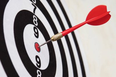 Dart hit target close-up. well aimed hit. winning the competition. Success in business. achievement in life. Go to its goal. achieve the goals. The game of Darts. Sports target. targeted advertising clipart