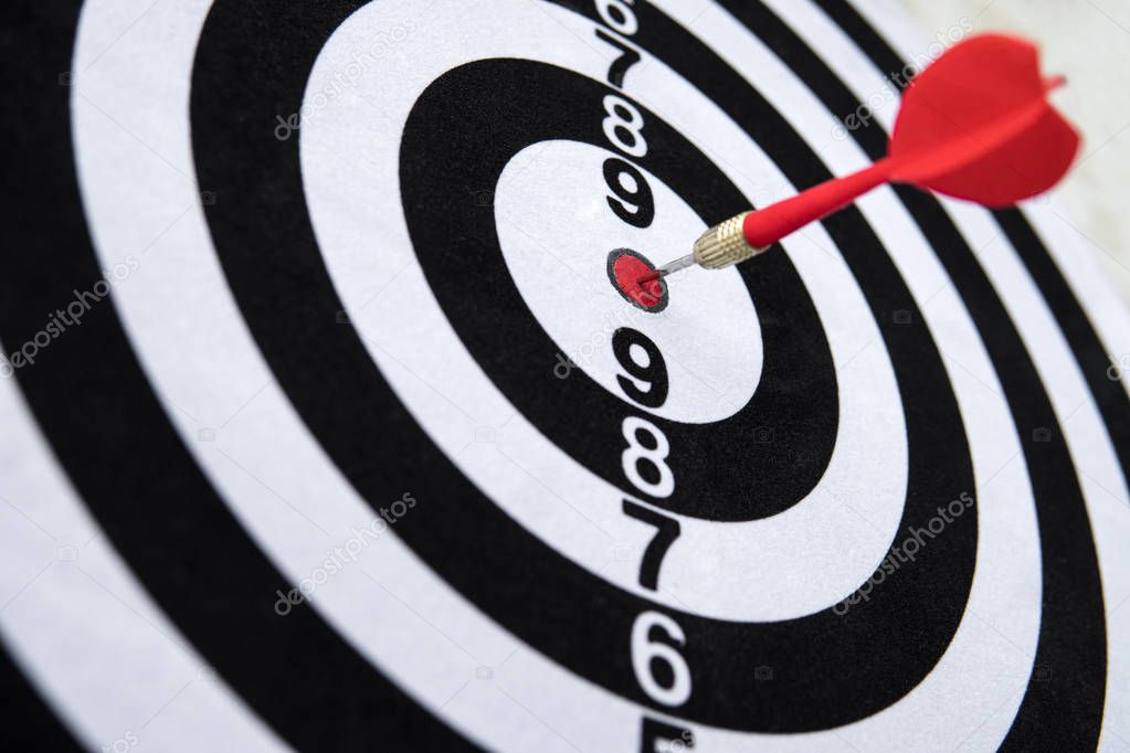 Dart hit target close-up. well aimed hit. winning the competition. Success in business. achievement in life. Go to its goal. achieve the goals. The game of Darts. Sports target. targeted advertising