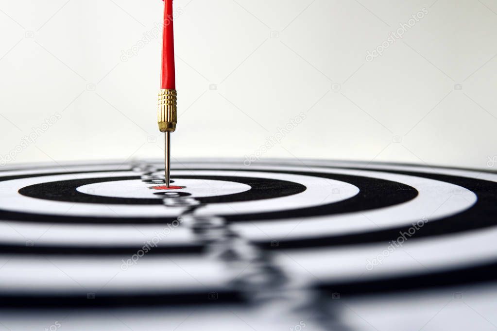 Dart hit target close-up. well aimed hit. winning the competition. Success in business. achievement in life. Go to its goal. achieve the goals. The game of Darts. Sports target. targeted advertising