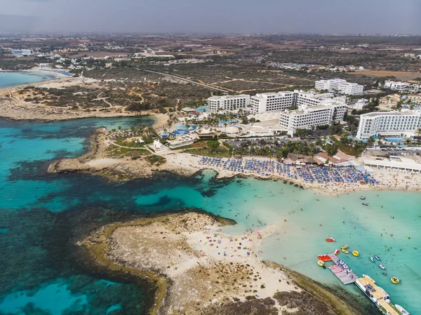 Top view of city of Cyprus and the city of Ayia NAPA. Air view of the resort Mediterranean coastal city. Tourist town. Nissi Beach. — Stock Photo, Image