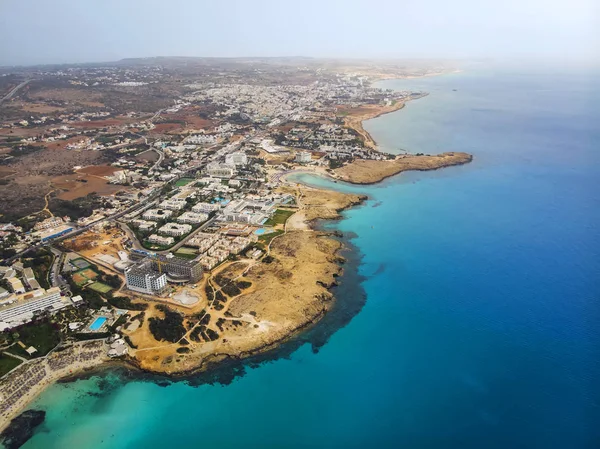 Top view of city of Cyprus and the city of Ayia NAPA. Air view of the resort Mediterranean coastal city. — Stock Photo, Image