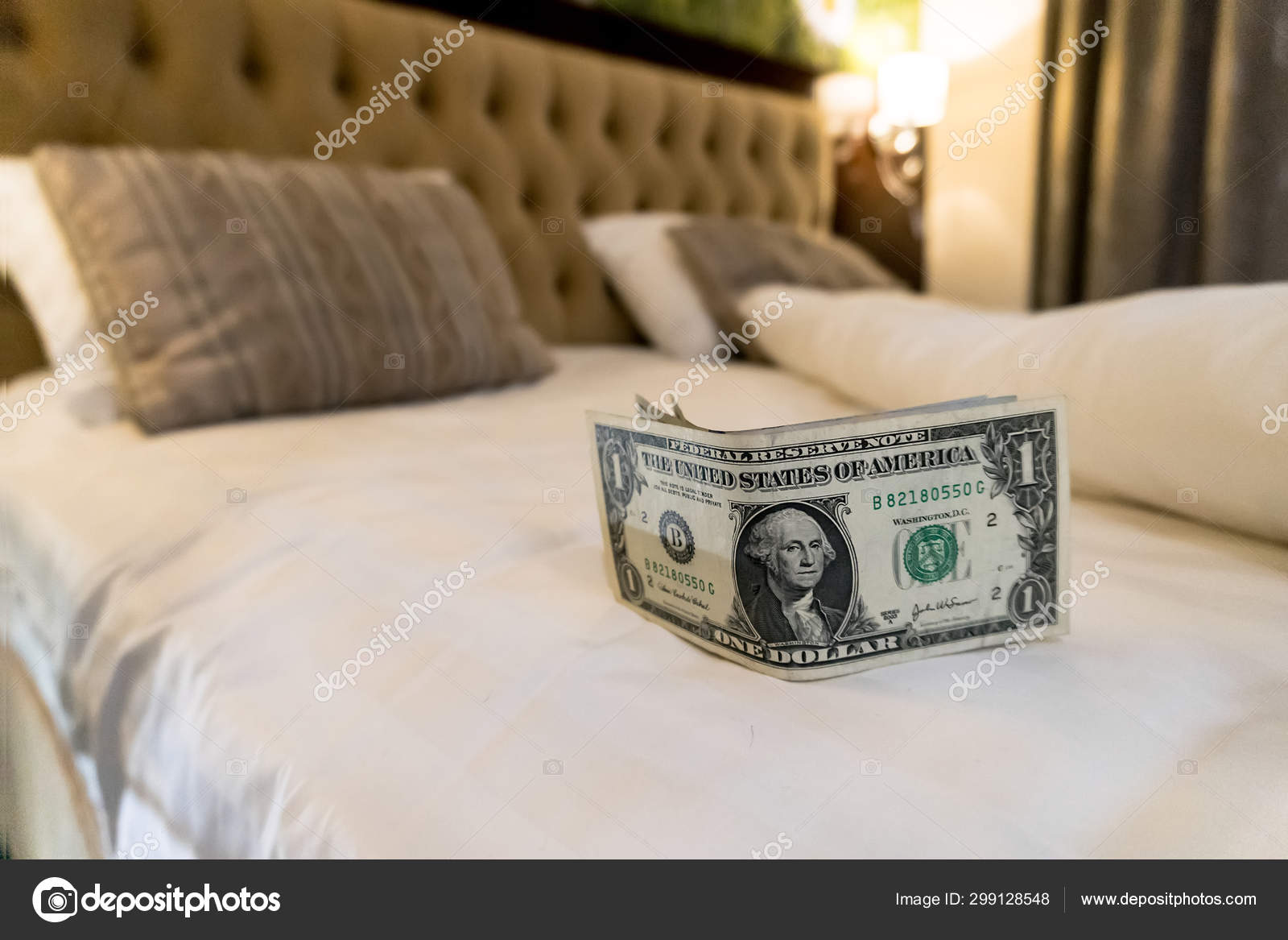 Paying Money Dollar On White Bed In Hotel Stock Editorial
