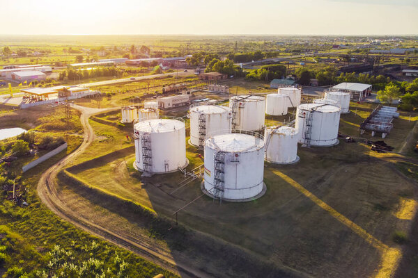Tanks with petroleum products are among fields near the village. The view from the top. aerial view. refuelling