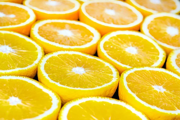 Fundo abstrato com citrinos de fatias de laranja. Fechar. — Fotografia de Stock