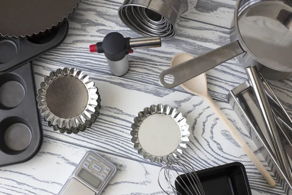 Kitchen Tools. cooking utensils for baking. various shape and size container for baking use. Assorted baking utensils on a wooden background