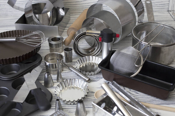 Kitchen Tools. cooking utensils for baking. various shape and size container for baking use. Assorted baking utensils on a wooden background