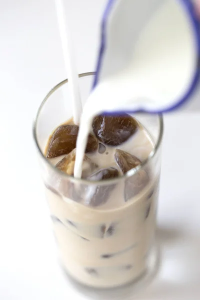 coffee ice in glass. Iced coffee cocktail or frappe with ice cubes and cream